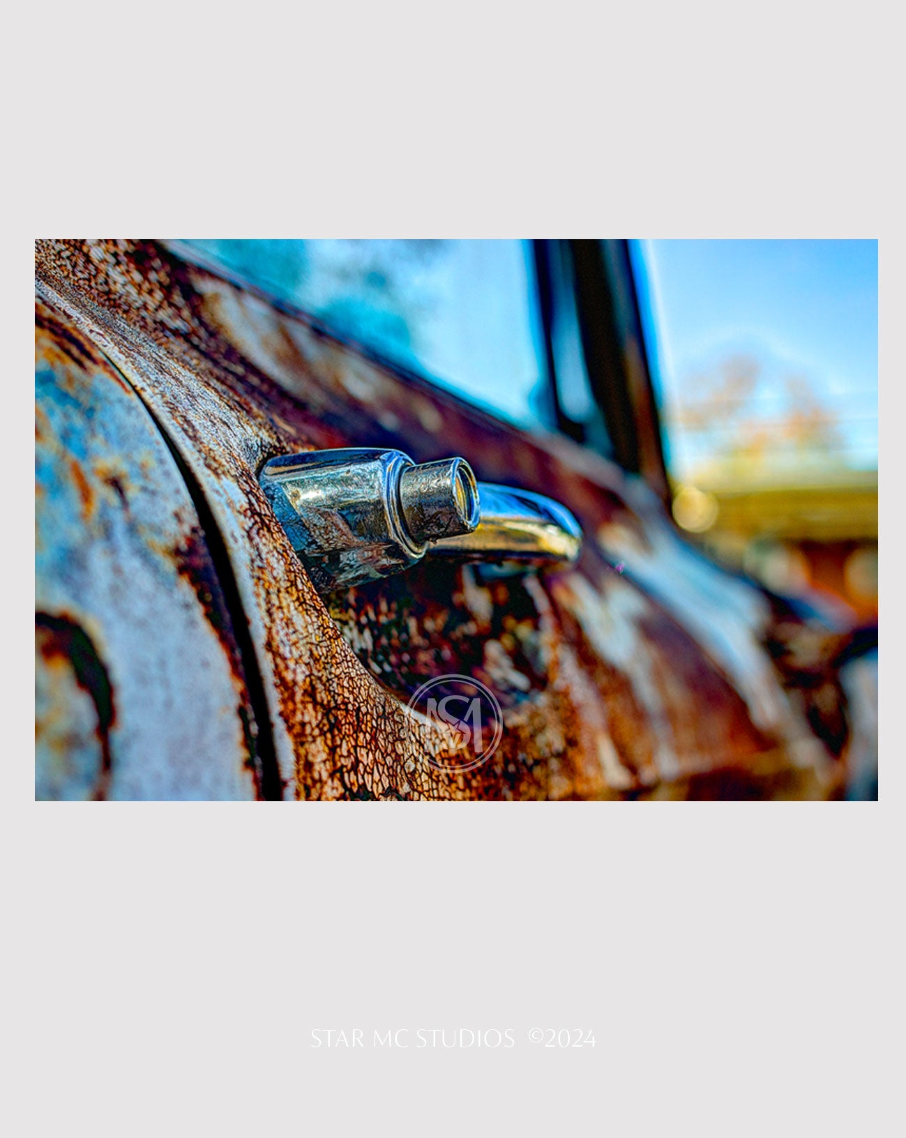 Close-up of a patina-covered vintage GMC truck door, captured in limited edition fine art photography—textured, moody wall art printed on ChromaLuxe metal or Museum Quality Fine Art Paper.