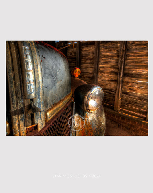 Close-up of a vintage 1941 Ford F-100 truck illuminated by golden twilight, captured in limited edition fine art photography—rustic Southern wall art for collectors.